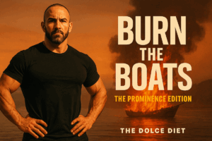 Mike Dolce stands powerfully on a rocky shore with a burning boat in the background. Bold text reads Burn the Boats